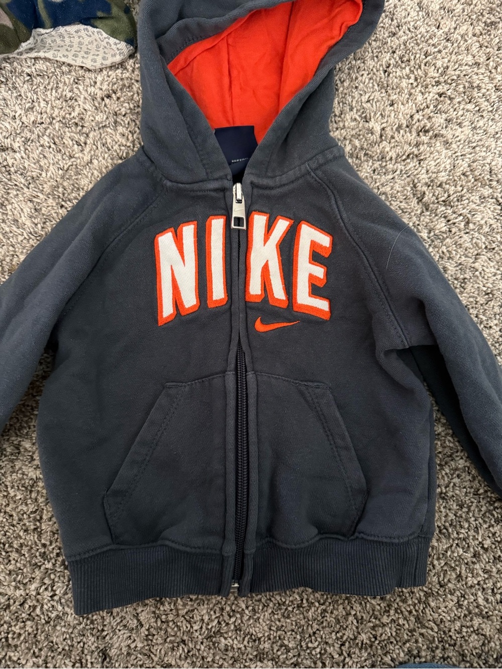 Nike Kids Navy Zip Hoodie with Orange Lining and Lettering